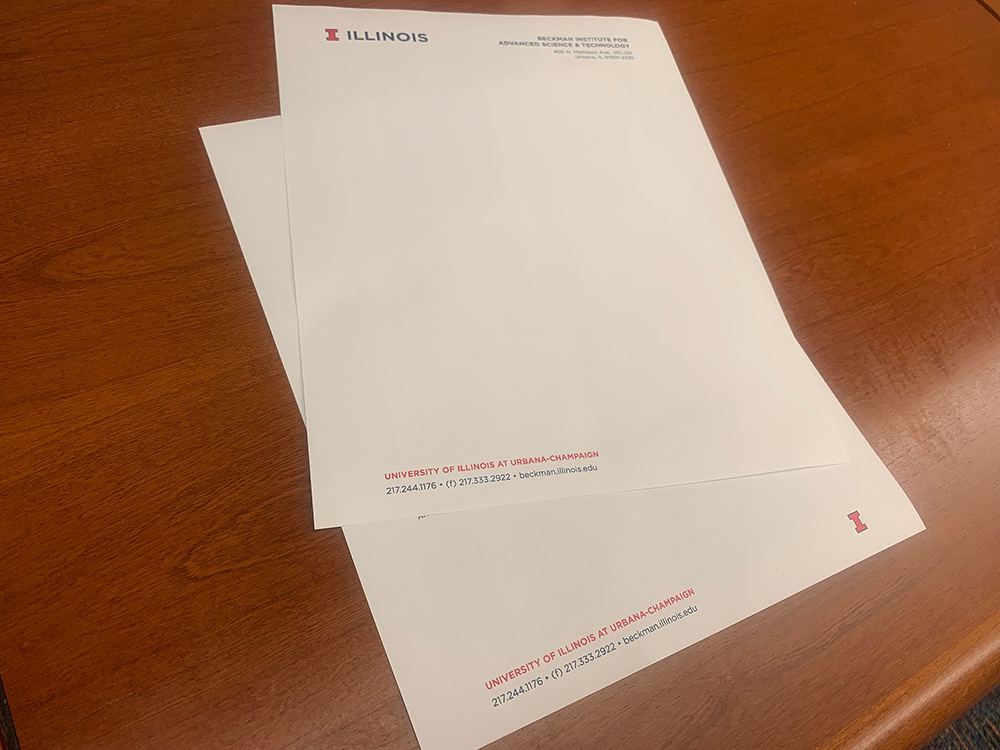 A photo of blank Beckman letterhead. It has the campus logo in the top left corner and Beckman's address in the top right corner.