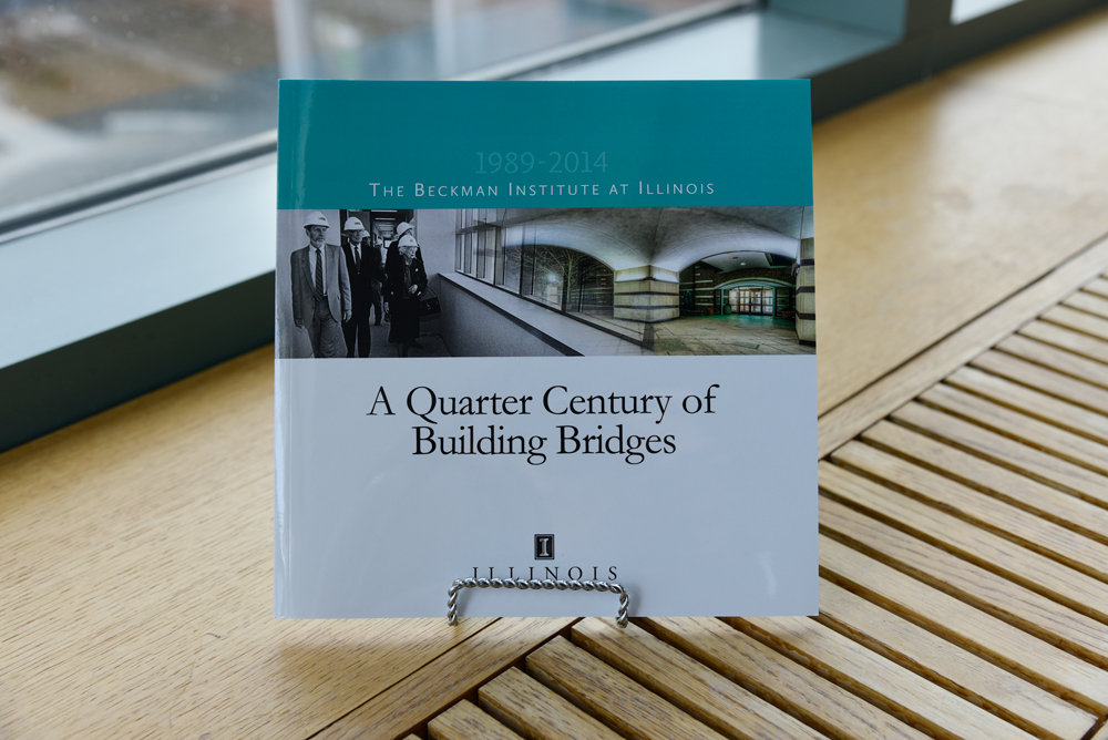 The cover of the book, "A Quarter Century of Building Bridges," which celebrates 25 years of the Beckman Institute at the University of Illinois at Urbana-Champaign (UIUC)